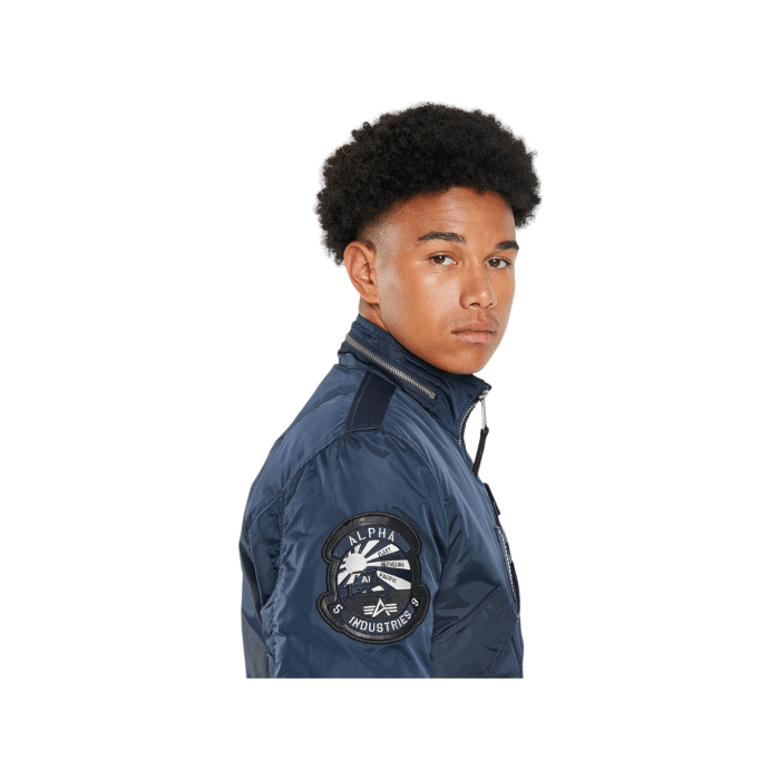 364 1C | The Alpha Engine Jacket in Rep Blue offers a perfect blend of durability and style, featuring a water-resistant outer shell and soft insulation. Ideal for any adventure, this jacket ensures you stay warm and dry while looking effortlessly chic.