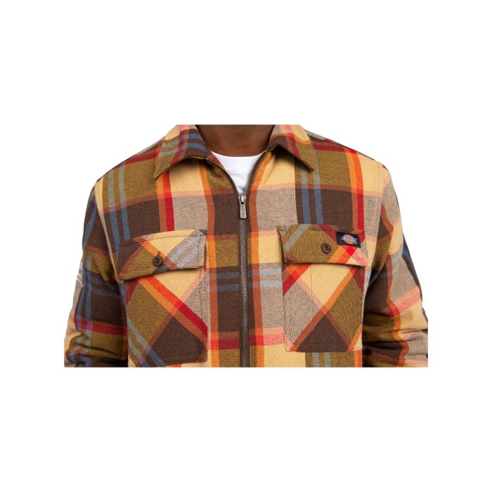 377 4B | The Dickies Ohio Check LS Shacket in Brown Multi Colour combines the best of a shirt and a jacket, offering versatile style and practicality. Made from a durable cotton-polyester blend, it features a classic check pattern, dual chest pockets, and a relaxed fit, perfect for layering and everyday wear.