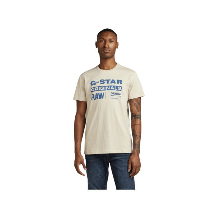 807 54A | The G Star Crew Graphic 8 R T in Cream Colour boasts a striking graphic on the front, providing a modern touch to its timeless crew neck style. Made from high-quality cotton, this T-shirt offers excellent comfort and durability, perfect for both casual and stylish everyday wear.