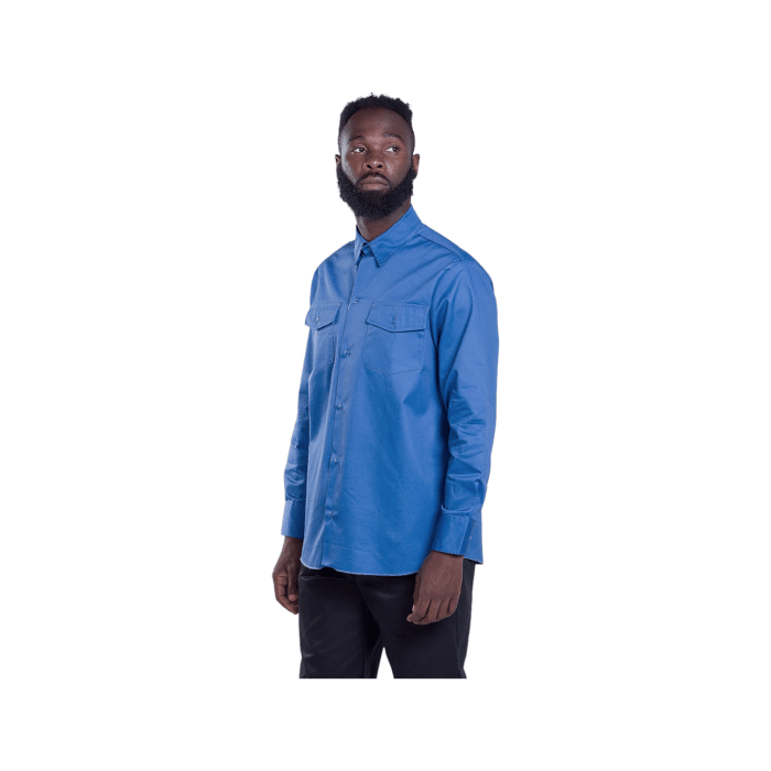 95 8A | The Dickies Shirt 847 Long Sleeve in Light Blue is a durable, comfortable work shirt made from a blend of polyester and cotton, featuring moisture-wicking properties, a relaxed fit, and twin chest pockets for functionality and style.