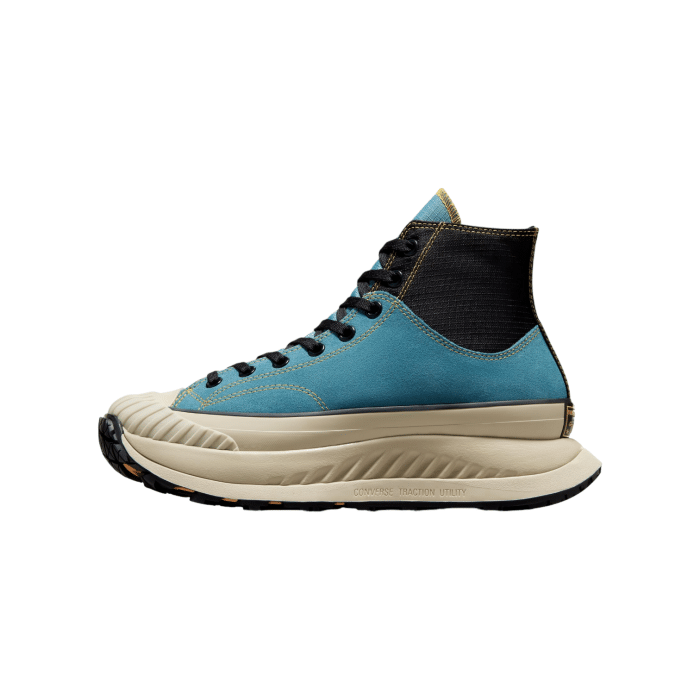 133 156A | The Converse Chuck 70 AT-CX Hi in Noble Blue-Black-Yellow reimagines a timeless classic with bold, contemporary updates. With a striking noble blue upper, contrasting black details, and vibrant yellow accents, this high-top sneaker delivers a perfect blend of vintage charm and modern comfort.