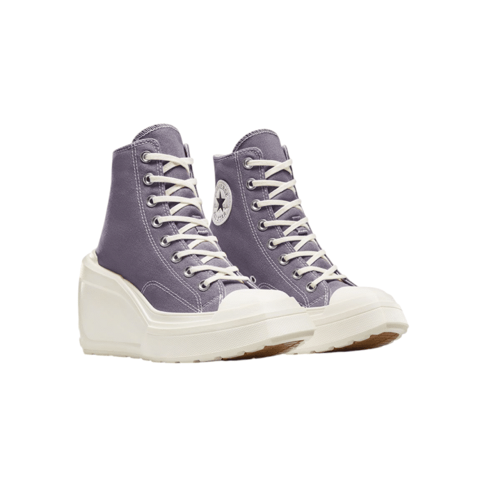 133 161B | Elevate your style with the Converse Chuck 70 De Luxe Wedge Hi in a stunning Lavender Ash color, featuring a high wedge sole that adds a bold twist to the classic Chuck 70 silhouette. Crafted for those who love a mix of comfort and chic, this unique design offers both height and timeless appeal, making it a must-have for any wardrobe.