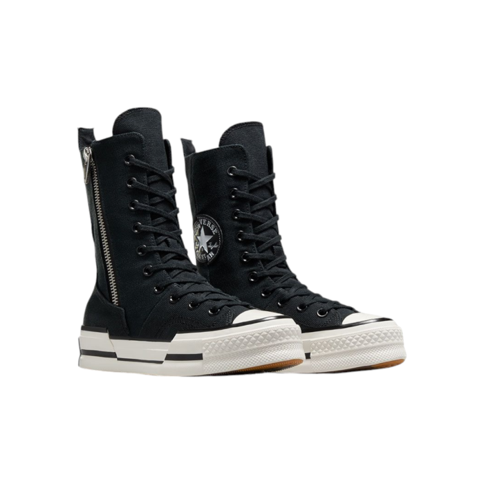 133 163B | Step up your sneaker game with the Converse Chuck 70 Plus X-Hi in sleek Black, featuring an extra-high silhouette that elevates the classic Chuck 70 design to new heights. With premium materials and enhanced cushioning, this bold shoe combines timeless style with modern comfort, making it perfect for any outfit or occasion.