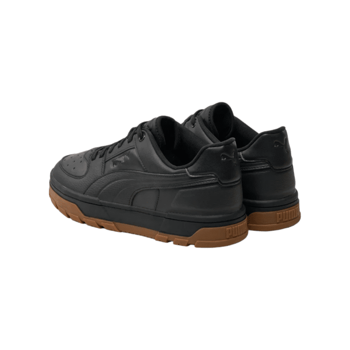 5 182B | The Puma Caven 2.0 in Puma Black-Gum-Puma White combines classic design with modern flair, perfect for both casual and athletic wear. Featuring a sleek black base, gum accents, and subtle gold detailing, this shoe effortlessly elevates your style while ensuring maximum comfort and durability.