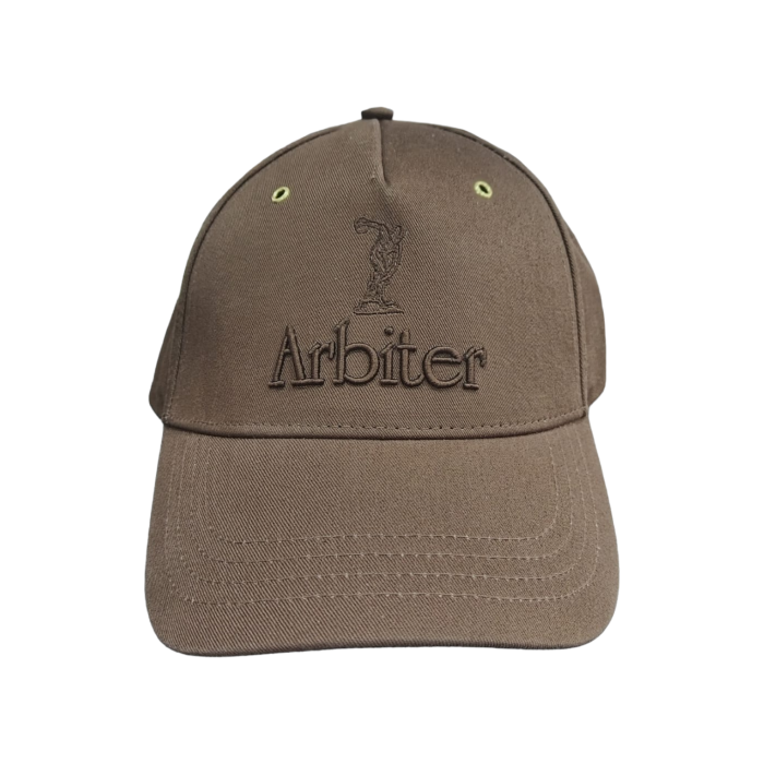 652 9A | The Arbiter Sports Peak Cap in Arbiter Cap Logo Core Brown offers a perfect blend of style and functionality, featuring durable, breathable fabric and an adjustable fit for all-day comfort. Its sleek color and structured design make it a versatile accessory, ideal for both athletic and casual wear.