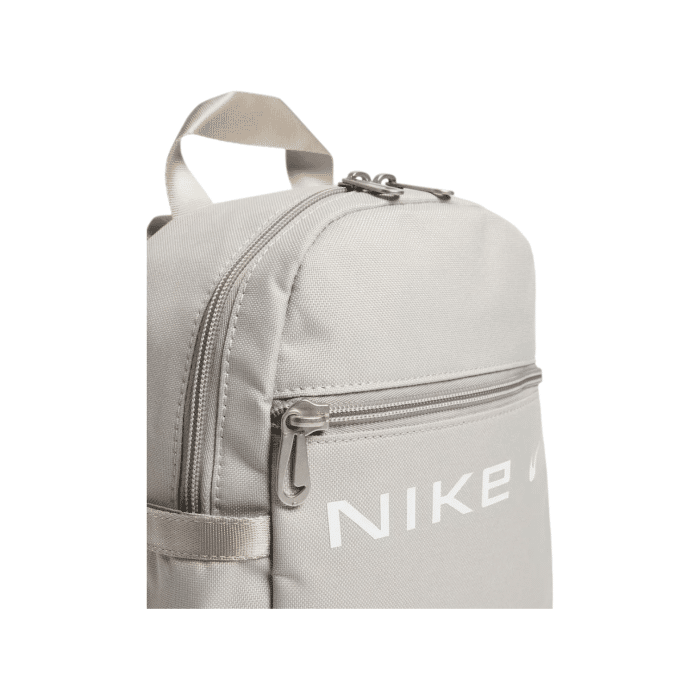 255 23C | The <em>Nike Futura Mini Backpack</em> in Grey is a compact yet stylish accessory, perfect for daily essentials. With a 6-liter capacity, it offers just enough space to carry your must-haves, while maintaining a sleek and modern profile. Designed for both comfort and convenience, its durable material and adjustable straps ensure it fits seamlessly into your active lifestyle.