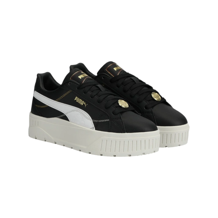 334 86A | The Puma Karmen II Class Act in Black, White and Gold features a luxurious suede upper and a durable rubber sole, combining elegance and practicality. Designed for all-day comfort, these versatile sneakers seamlessly transition from casual outings to more polished occasions.