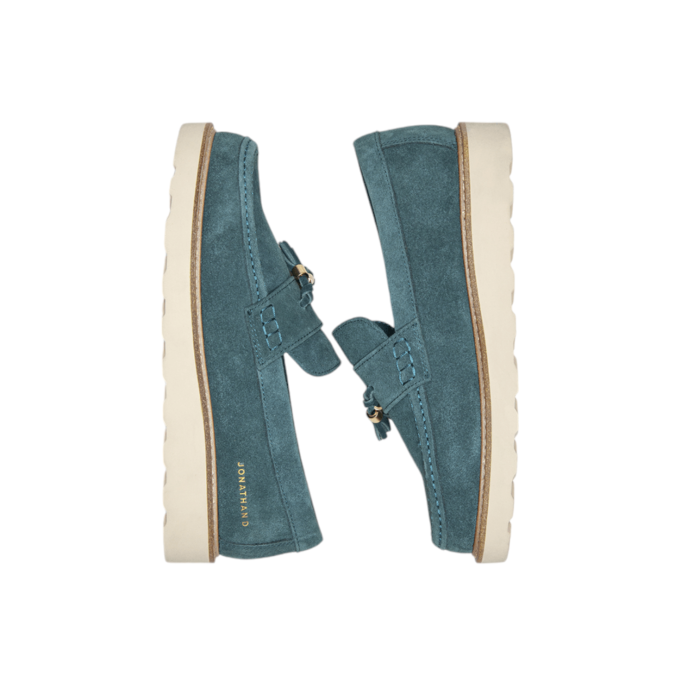 55 49B | The Jonathan D Scout Tassel Suede shoes in Teal color effortlessly combine sophistication and modern style, making them a versatile addition to any wardrobe. Crafted from high-quality Suede with a sleek tassel detail, these shoes offer a polished look that's perfect for both formal occasions and smart-casual outfits.