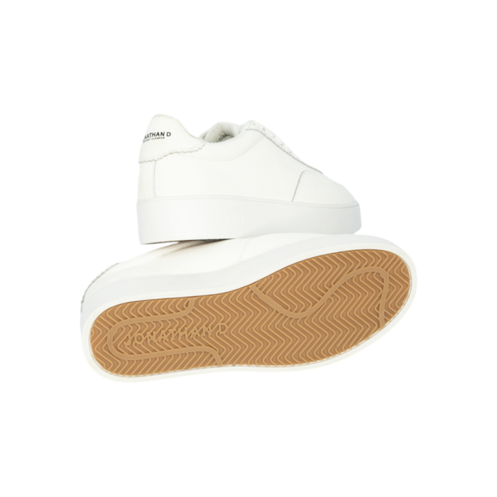 55 97B | The Jonathan D Cort Lace Up Sneaker PU Leather in White color effortlessly combine sophistication and modern style, making them a versatile addition to any wardrobe. Crafted from high-quality PU Leather with a sleek detail, these shoes offer a polished look that's perfect for both formal occasions and smart-casual outfits.