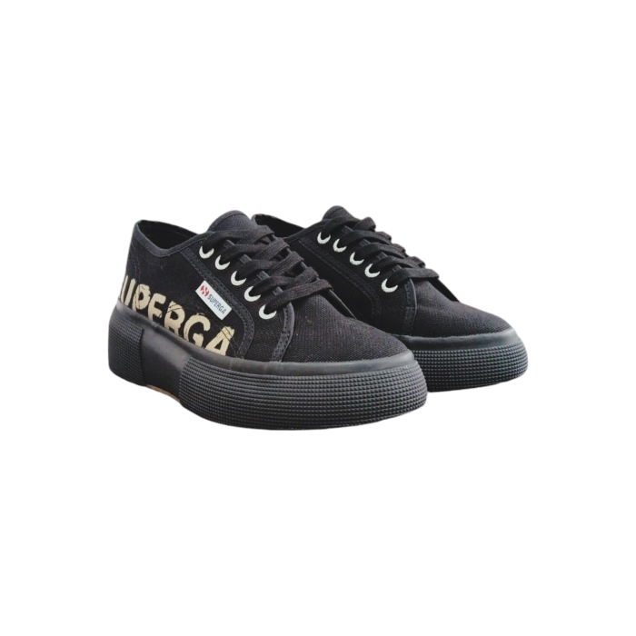 556 29B | Step up your sneaker game with the Superga 2287 Platform Lettering in a sleek black canvas, featuring bold bronze lettering on the canvas for a striking contrast. The elevated platform design not only adds height but also delivers a chic, modern edge that pairs effortlessly with any casual outfit.