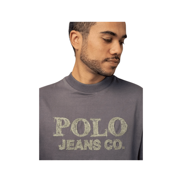 303 119B | The Polo Crew PJC Logo T-Shirt in charcoal is a stylish and versatile addition to any wardrobe, crafted from high-quality cotton that ensures both comfort and breathability throughout the day. Featuring a classic crew neckline and a relaxed fit, this t-shirt flatters all body types while showcasing a prominent PJC logo on the front, adding a touch of modern sophistication to your casual look. Durable and easy to care for, this essential piece not only retains its shape and color wash after wash but also reflects the brand's commitment to sustainability, making it a responsible choice for fashion-forward individuals.