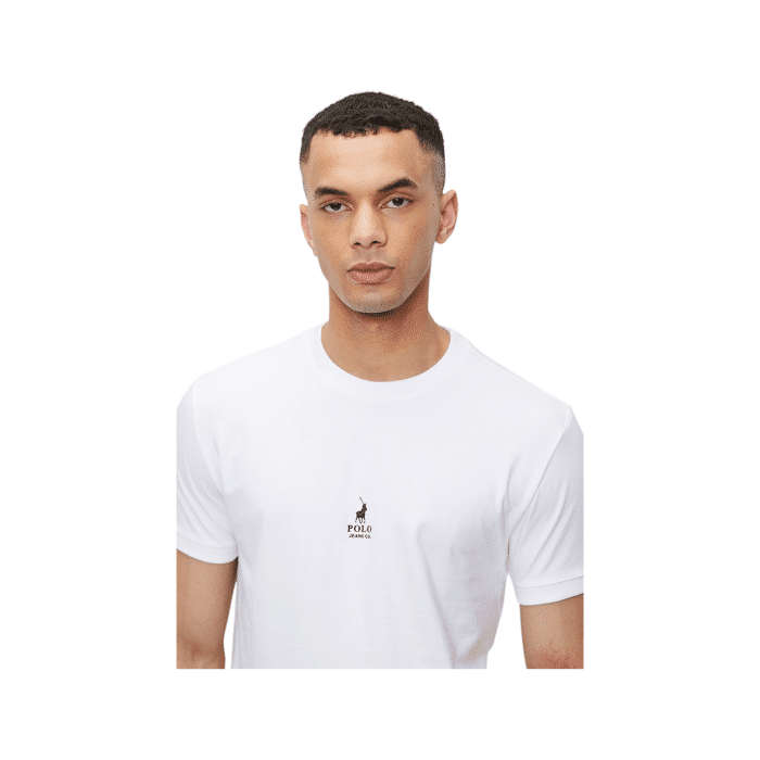 303 98B | The Polo T-Shirt PJC Cuffed  in white is a stylish and versatile addition to any wardrobe, crafted from high-quality, breathable cotton for exceptional comfort throughout the day. With its unique cuffed sleeves and classic crew neckline, this t-shirt effortlessly combines a laid-back vibe with a polished look, making it perfect for both casual outings and more refined occasions. Emphasizing durability and sustainability, this t-shirt not only maintains its shape and softness wash after wash but also supports responsible manufacturing practices, ensuring you look good while making a positive impact.