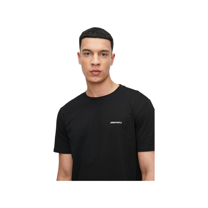 47 10C | The Jonathan D T-Shirt Celer in Black offers a sleek, minimalist design crafted from soft, breathable cotton, providing both comfort and durability for everyday wear. Its versatile black hue and classic fit make it a perfect choice for effortless style, whether dressed up or down.