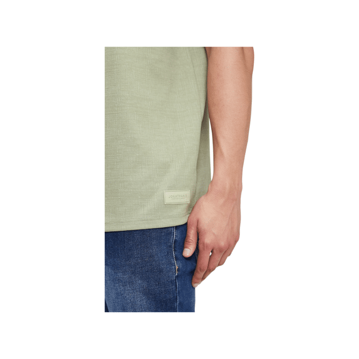 47 29B | The Jonathan D T-Shirt Otto in Sage Green offers a sleek, minimalist design crafted from soft, breathable cotton, providing both comfort and durability for everyday wear. Its versatile Sage Green hue and classic fit make it a perfect choice for effortless style, whether dressed up or down.