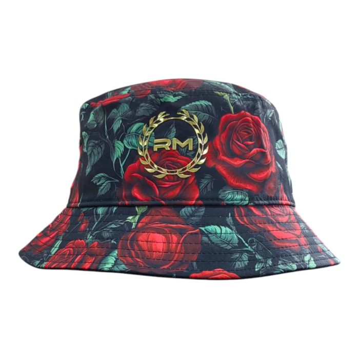 479 55 B | The Rossimoda Bucket Hat Rose Garden is a stylish and versatile accessory that features a vibrant floral print, showcasing delicate roses in rich colors that add a touch of elegance to any outfit. Crafted from high-quality, breathable materials, this hat not only offers comfort but also provides ample sun protection with its wide brim, making it perfect for outdoor activities and sunny days. With its adjustable inner band for a secure fit and packable design, the Rose Garden Bucket Hat effortlessly combines practicality and chic style, allowing you to express your individuality while enjoying both comfort and flair.