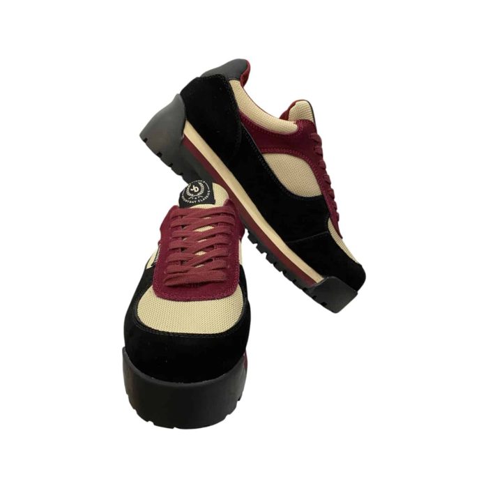 55 112D | The Jonathan D Sneaker in Jimmy Dusk Maroon/Black combines bold style and comfort, featuring a high-quality synthetic and suede upper in a striking maroon and black colorway that adds sophistication to any outfit. Its cushioned insole and breathable lining ensure all-day comfort, while the durable rubber outsole provides excellent traction and stability on various surfaces. With its sleek design and subtle stitching details, this sneaker transitions effortlessly from casual wear to more polished looks, making it a versatile and stylish addition to any modern wardrobe.