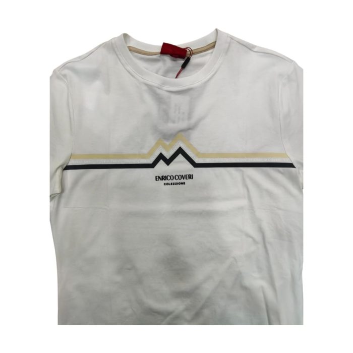 559 72 C | The <strong>Enrico Coveri T-Shirt with Zig-Zag Stripe Print in White</strong> features a bold and dynamic zig-zag pattern that adds a playful touch to the classic white tee, making it a standout piece for any casual outfit. Crafted from high-quality, breathable fabric, this t-shirt ensures all-day comfort while maintaining a modern slim-fit silhouette that flatters various body types. With its eye-catching design and versatile style, this t-shirt effortlessly transitions from relaxed daytime wear to stylish evening outings, allowing you to express your unique personality with ease.