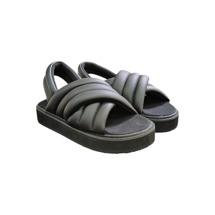 57 22B | The Jonathan D Puffed Jonah Slip-On Slide in Crow Black offers a sleek and modern design that merges style with comfort. Featuring a puffed upper for a snug yet cushioned fit, it’s crafted for all-day wear while the monochromatic black color adds a bold, versatile touch that easily complements any casual outfit. Its lightweight sole provides excellent traction, and the molded footbed ensures long-lasting comfort, making it the perfect go-to slide for everyday wear.