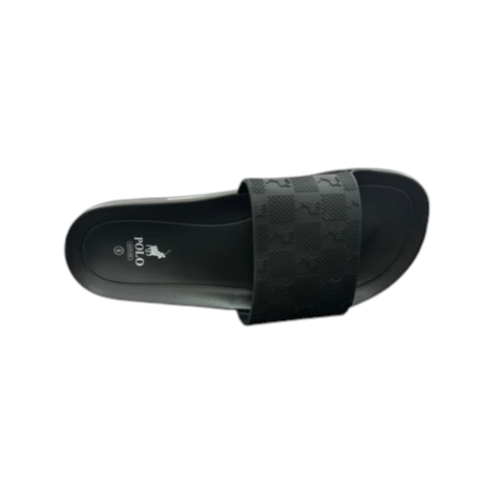 664 1A | The Polo Polo Block Monogram Pool Sandal in Black offers a sleek, minimalist design perfect for laid-back summer days by the pool or casual strolls. Featuring a cushioned footbed for enhanced comfort and a durable rubber outsole for superior traction, these slides are both stylish and practical. With its bold black base and contrasting monogram detailing, this versatile slide combines effortless sophistication with water-resistant functionality for any warm-weather occasion.