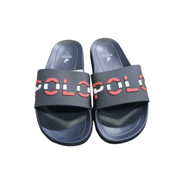 664 2B | The Polo Pool Slide in Navy with Red Detail offers a sleek, minimalist design perfect for laid-back summer days by the pool or casual strolls. Featuring a cushioned footbed for enhanced comfort and a durable rubber outsole for superior traction, these slides are both stylish and practical. With its bold Navy base and contrasting Red detailing, this versatile slide combines effortless sophistication with water-resistant functionality for any warm-weather occasion.