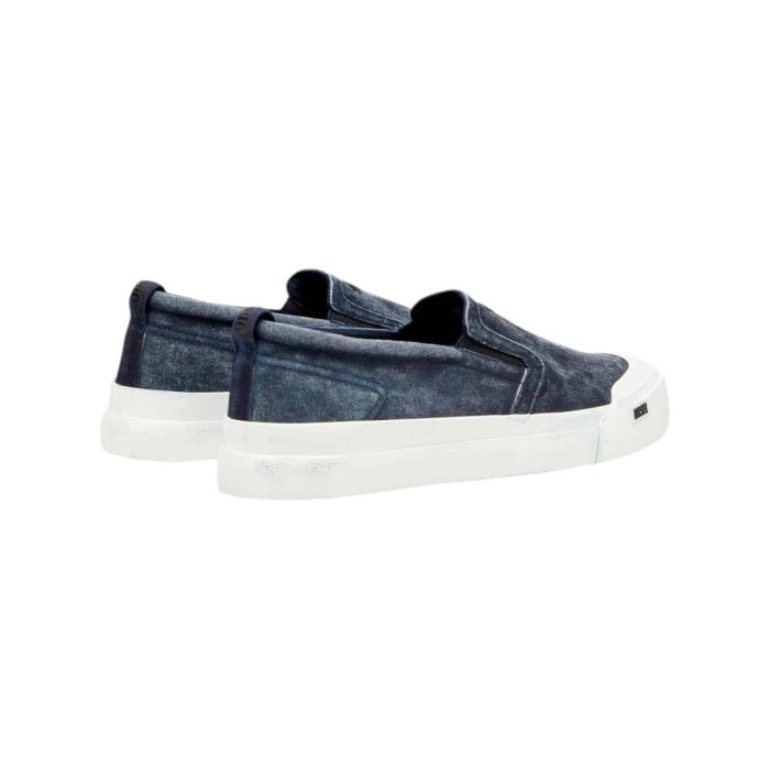 861 57B | The Diesel S-Athos Slip-On in Outer Space combines modern design with ultimate convenience, featuring a sleek silhouette crafted from premium materials that ensure both durability and style. With its deep navy hue and minimalistic aesthetic, this slip-on sneaker seamlessly transitions from casual outings to more polished looks, making it a versatile addition to any wardrobe. Designed for comfort, it includes a cushioned insole and elastic side panels that provide a snug fit, allowing you to effortlessly slip them on and enjoy all-day wear without compromising on flair.