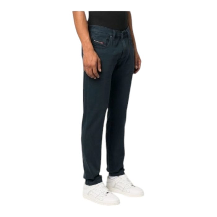 867 8 E | The Diesel Jeans D-Strukt Navy combines modern style with unmatched comfort, featuring premium denim that hugs your body perfectly while allowing for easy movement throughout the day. With a classic five-pocket design and a deep navy hue, these jeans are versatile enough to transition seamlessly from casual outings to more polished events, making them a staple in any wardrobe. The subtle distressed details and straight-leg cut enhance their contemporary appeal, while reinforced stitching ensures durability, allowing you to enjoy both style and functionality for years to come.