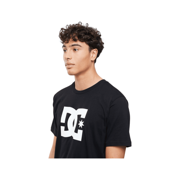 1090 4C | The DC Shoes T Shirt Star Logo S/S in Black/White blends comfort and style effortlessly, featuring a crisp white DC star logo against a sleek black background for a sharp, urban look. Made from 100% premium cotton, this tee provides a soft, breathable feel perfect for all-day wear and versatile layering across seasons. Its relaxed fit and classic crew neck design make it easy to pair with jeans, shorts, or jackets, making it an essential piece for anyone who values durable, skate-inspired fashion with a modern edge.