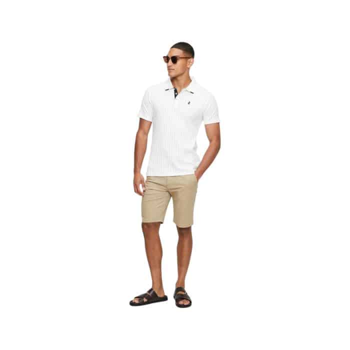 302 75 E | The Polo SS Textured Golfer in Off White offers a perfect blend of comfort, style, and versatility, crafted from a high-quality, breathable cotton blend that ensures all-day wearability. Its textured fabric adds a sophisticated touch to the classic polo design, while the off-white color provides a clean, modern look that can easily be paired with a variety of bottoms. The tailored fit, combined with a classic polo collar and short sleeves, makes this shirt a timeless addition to any wardrobe, ideal for both casual outings and more polished, smart-casual occasions.