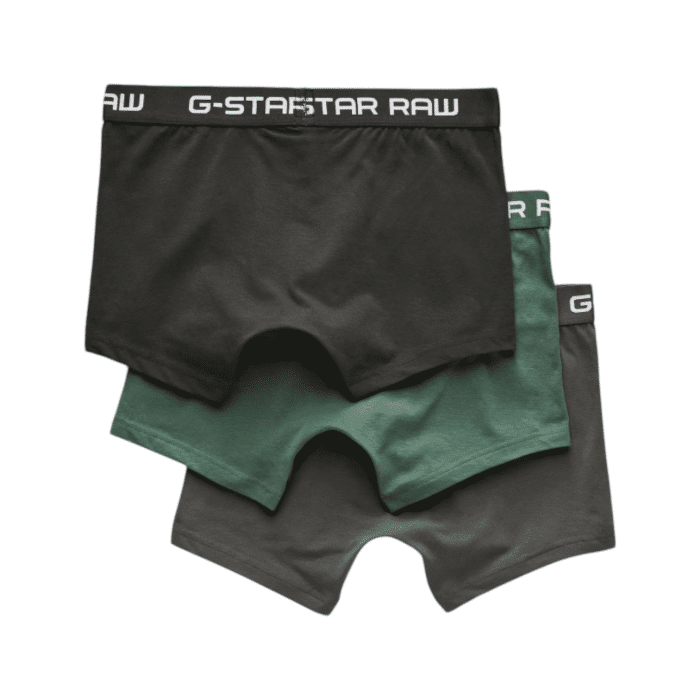 596 3A | The G-Star Classic Trunks 3-Pk in multiple green colours offer a snug fit that ensures all-day comfort, featuring a sewn-in pouch for added support and short legs that stay in place without riding up. Made from a blend of 95% organic cotton and 5% elastane, these classic trunks provide a super stretch for optimal flexibility and shape retention, while the jersey knit fabric feels soft to the touch and is breathable for maximum comfort. With the signature G-Star RAW elastic waistband, this set of three delivers reliable support, combining style, comfort, and sustainability in every pair.