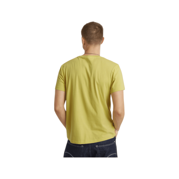 807 100B | The G-Star Crew Construction R T in Linden Green is a versatile, regular-fit t-shirt crafted for both comfort and style, featuring a classic round neck, short sleeves, and a ribbed neckline that enhances durability and shape retention. Made from 100% organic cotton with a tightly knitted jersey weave, it offers a smooth, clean surface that feels soft and breathable, ensuring lasting comfort. A bold graphic print on the front adds a modern edge to this timeless piece, making it perfect for pairing with jeans or shorts for a polished, casual look.