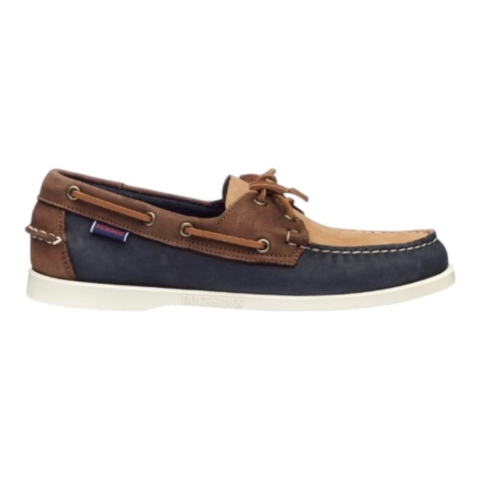 82 9 B | The Sebago Docksides Portland Archives in Navy/Brown combines classic nautical style with high-quality craftsmanship, making it a versatile addition to any wardrobe. Crafted from premium full-grain leather in rich navy and brown tones, these boat shoes feature a hand-sewn moc-toe design and durable, slip-resistant rubber soles for reliable traction on wet and dry surfaces. With rawhide laces and a soft leather lining for comfort, these shoes offer both timeless elegance and dependable functionality, perfect for casual outings or seaside adventures.