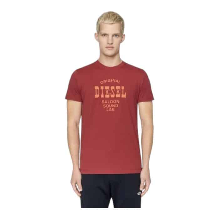 862 22 B | The Diesel T-Diegor E12 Red T-shirt is a bold and stylish wardrobe essential crafted from 100% premium cotton for unmatched comfort and durability. Its vibrant red hue and classic crew-neck design create a versatile piece that pairs effortlessly with casual or edgy outfits, while the subtle Diesel branding adds a touch of modern sophistication. Designed for everyday wear, this T-shirt offers breathable fabric, easy maintenance, and a universally flattering fit, making it a standout choice for fashion-forward individuals.