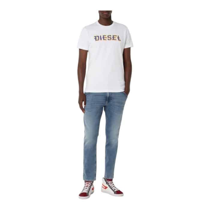 862 33 D | The Diesel T-Shirt T-Diegor K52 White combines premium craftsmanship with a sleek, minimalist design, making it a versatile addition to any wardrobe. Crafted from 100% high-quality cotton, it offers unmatched comfort and durability, featuring a regular fit and a classic crew neckline that flatters a variety of styles. Enhanced by Diesel’s iconic logo on the chest, this T-shirt effortlessly blends urban edge with timeless sophistication, perfect for casual outings or layering for a more polished look.