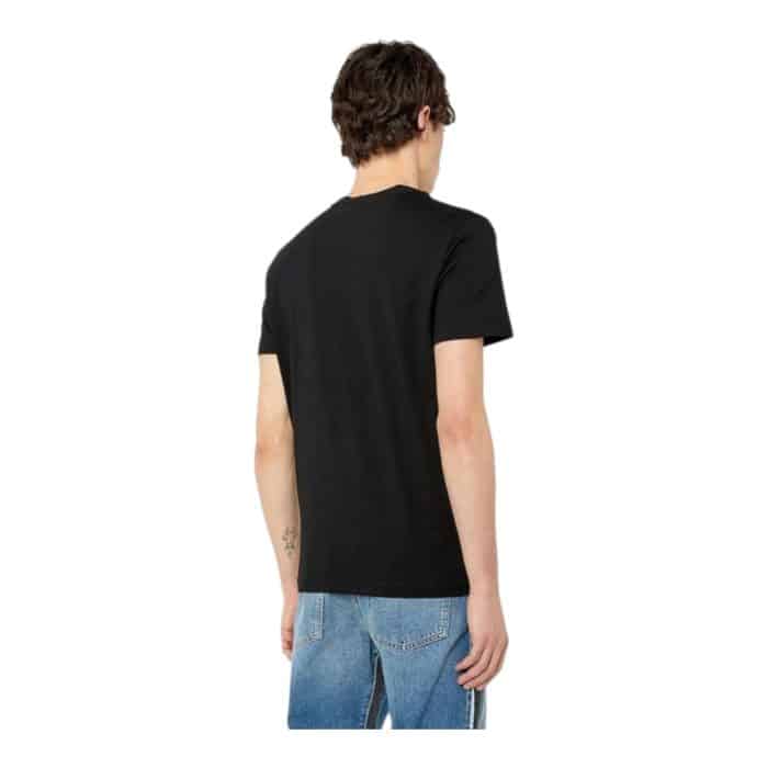 862 42 C | The Diesel T-Shirt T-Diegor K54 Black combines minimalist design with bold branding, making it a versatile staple for any wardrobe. Crafted from 100% premium cotton, it offers a soft, breathable feel and a regular fit that ensures all-day comfort while maintaining a sleek silhouette. Featuring Diesel’s iconic logo prominently on the chest, this timeless black T-shirt effortlessly transitions from casual outings to layered streetwear looks with modern sophistication.