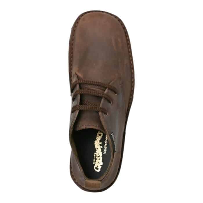 106 23 B | The Grasshoppers Griffin Coffee Sandiego/Suede slip-on shoe combines timeless elegance with modern comfort, making it an ideal choice for everyday wear. Crafted from rich coffee-toned suede, this versatile design features a soft, flexible upper that molds to your foot, while the padded insole ensures all-day cushioning and support. Its sleek silhouette, accented with subtle stitching details, seamlessly transitions from casual outings to polished ensembles, offering a perfect balance of style and functionality.