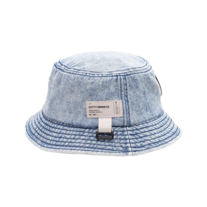 12 10A | Elevate your style with the Cutty Floppy Oasis Bucket Hat in blue denim, featuring a bold embroidered "C" and a classic washed design for a retro-inspired yet modern look. Crafted from durable and breathable fabric, this versatile hat combines comfort and functionality, making it perfect for sunny days, casual outings, or festival-ready outfits.