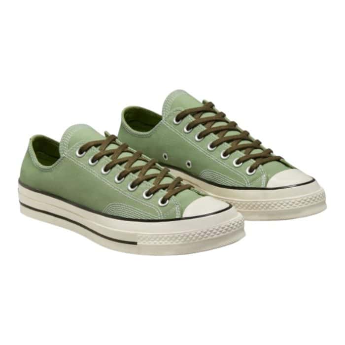 126 73 B | The Converse Chuck Low 70 Ox Alligator Friend/Utility/White combines vintage flair with a contemporary edge, featuring a durable canvas upper in a bold alligator green accented with utility and white tones. With its iconic low-top silhouette, cushioned insole, and textured rubber outsole, it delivers lasting comfort and reliable traction for everyday wear. Perfect for casual outfits or adding a pop of color to polished looks, this versatile sneaker is a stylish and timeless addition to any wardrobe.