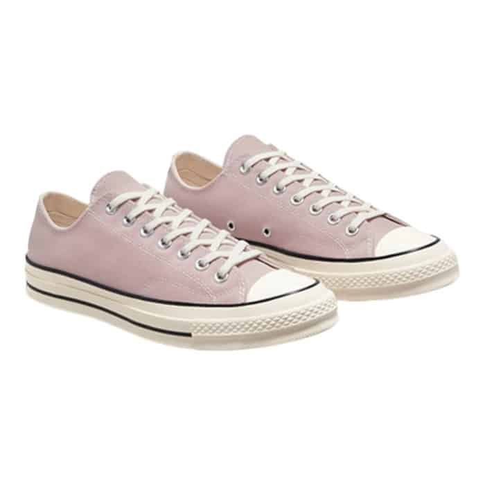 126 74 B | The Converse Chuck 70 Low in Stone Mauve / Egret / Black combines classic style with modern craftsmanship, featuring a premium canvas upper that offers durability and breathability for all-day comfort. Its unique Stone Mauve colorway, accented with Egret and Black details, gives it a versatile, contemporary look that easily pairs with various outfits, while the vulcanized rubber sole ensures superior traction and long-lasting wear. With a cushioned OrthoLite insole for added support and the iconic All Star patch, this sneaker blends heritage-inspired design with innovative features, making it a timeless yet functional addition to any wardrobe.