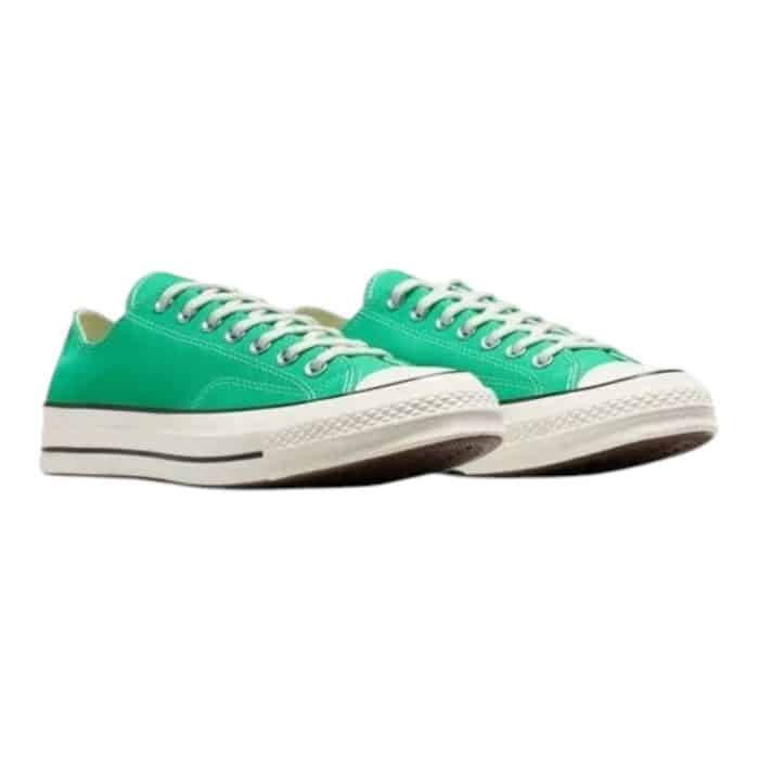 126 75 B | The Converse Chuck 70 Low OX in Prism Green/Egret/Black combines vintage-inspired design with modern craftsmanship, offering a bold yet versatile aesthetic. Its premium 12-ounce canvas upper, high-gloss rubber sidewall, and OrthoLite® insole ensure durability, comfort, and all-day support. Perfect for making a statement or complementing casual outfits, this timeless sneaker reimagines the classic Chuck Taylor for today’s style-savvy wearer.