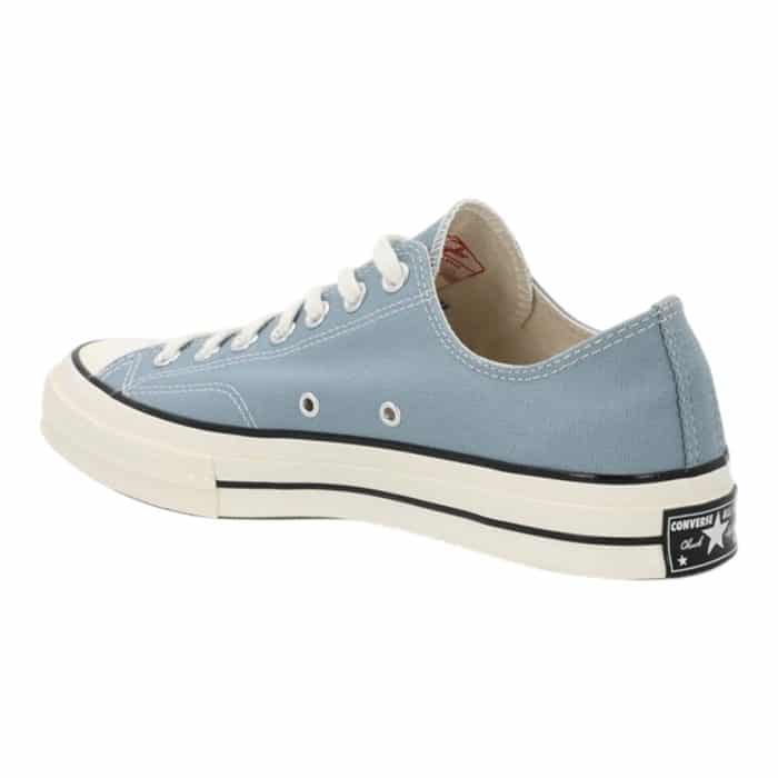 126 80 C | The Converse Chuck Taylor Low OX in Cacoon Blue/Egret/Black reimagines the timeless classic with a modern color palette that blends muted blue tones, creamy egret accents, and bold black details. Crafted with a durable canvas upper and a sturdy rubber sole, this sneaker offers unmatched comfort, breathability, and reliable grip for everyday wear. Its versatile design seamlessly pairs with casual and semi-casual outfits, making it a must-have for style-conscious individuals seeking effortless sophistication and functionality.