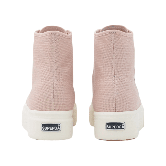 556 24C | The Superga 2708 Hi Top in pink features a breathable cotton canvas upper and comfortable cotton lining for all-day wear. With a platform heel, lace-up fastening, and durable synthetic sole, these sneakers offer a stylish and practical addition to your wardrobe.