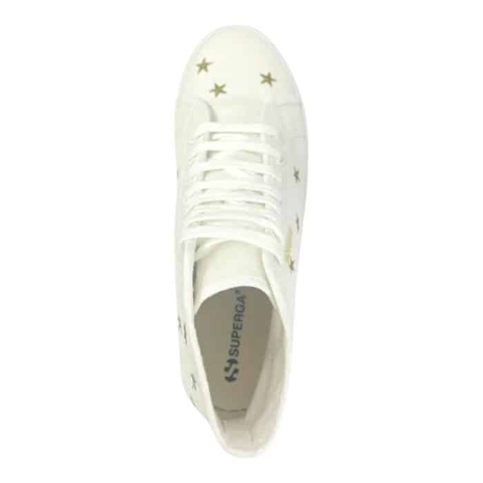 556 7 B 1 | The Superga 2341 Alpina Embroidery White/Gold Stars combines timeless elegance with rugged functionality, featuring a high-top white canvas design adorned with delicate gold star embroidery for a subtle yet eye-catching sparkle. Its signature Alpina lug sole adds a bold, edgy touch while offering excellent traction and durability, making it perfect for both casual outings and light adventures. With a comfortable padded footbed, gold-toned eyelets, and versatile styling, these sneakers effortlessly blend practicality and sophistication for any occasion.