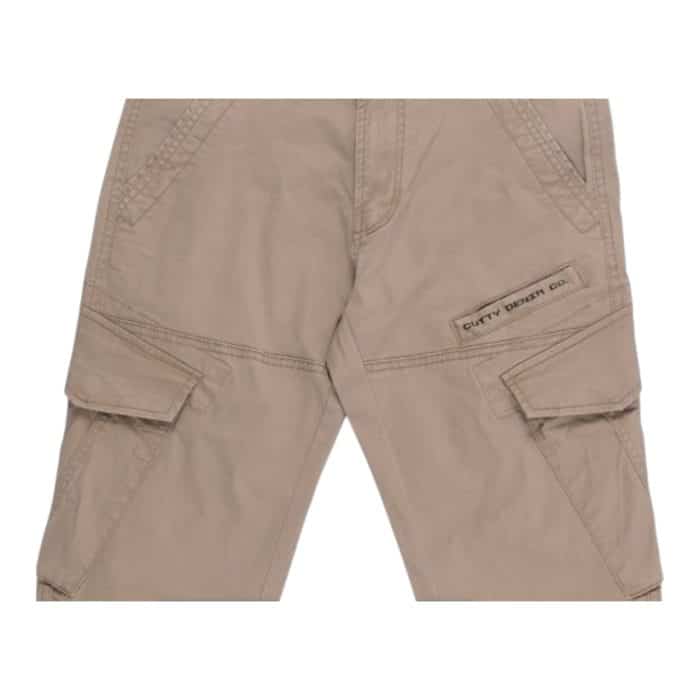 695 11 C | The Cutty Cargo Pants Chaven Camel are a versatile blend of style and functionality, designed with a relaxed fit and rugged durability to suit both outdoor adventures and urban settings. Crafted from high-quality camel-colored fabric, they feature multiple spacious pockets for practical storage, accented by reinforced stitching for enhanced longevity and a sleek, modern aesthetic. These cargo pants balance comfort and fashion seamlessly, making them an essential addition to any wardrobe seeking utility and timeless appeal.