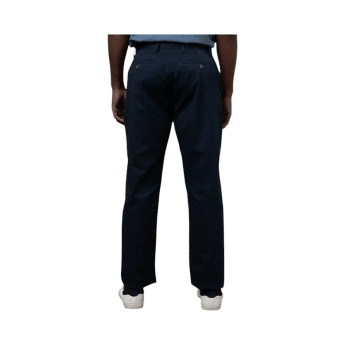 307 22A | The Polo Men's Chino Essential in navy offers a perfect blend of comfort and style. Made from a high-quality mix of 95% cotton and 5% spandex, these chinos feature a relaxed fit that ensures ease of movement. Designed with belt loops, a zip fly with button fastening, and functional pockets, they provide both practicality and sophistication. The classic navy color makes them versatile for any occasion, whether dressing up or down. Elevate your wardrobe with this timeless and functional chino.