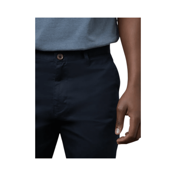 307 22B | The Polo Men's Chino Essential in navy offers a perfect blend of comfort and style. Made from a high-quality mix of 95% cotton and 5% spandex, these chinos feature a relaxed fit that ensures ease of movement. Designed with belt loops, a zip fly with button fastening, and functional pockets, they provide both practicality and sophistication. The classic navy color makes them versatile for any occasion, whether dressing up or down. Elevate your wardrobe with this timeless and functional chino.