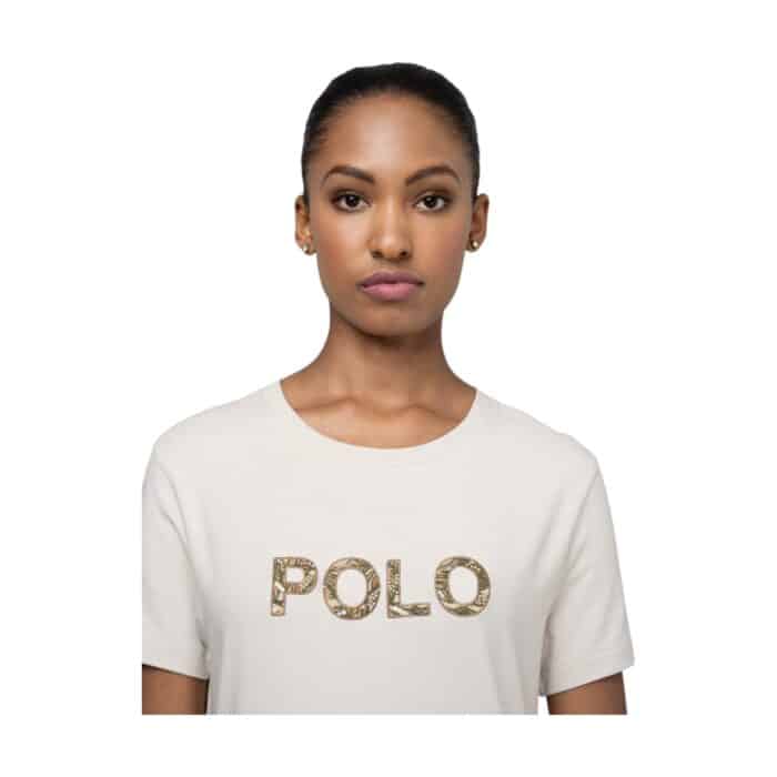 1004 3 A | The Polo T-Shirt Anele Embellished Putty Light Stone is a sophisticated blend of classic elegance and modern style, featuring high-quality fabric that ensures exceptional comfort, breathability, and durability for all-day wear. Designed with intricate embellishments on the chest, a finely stitched collar, and well-structured sleeves, this polo offers a polished and refined silhouette that effortlessly enhances any wardrobe. Its versatile putty light stone shade pairs seamlessly with various outfits, making it the perfect choice for casual, semi-formal, or smart-casual occasions where style and comfort are equally important.