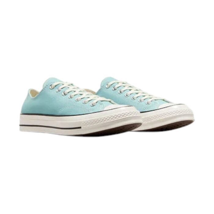 126 96 A | The Converse Chuck 70 Ox in Vernal Pool/Egret/Black blends vintage charm with modern durability, featuring a premium 12oz canvas upper in a refreshing teal hue, complemented by contrasting egret and black details for a timeless yet eye-catching aesthetic. Designed for comfort and longevity, this sneaker boasts an OrthoLite insole for superior cushioning, reinforced stitching for added resilience, and a vulcanized rubber sole that provides excellent traction on various surfaces. With its low-top silhouette, heritage-inspired details like the retro license plate on the heel, and versatile styling options, this Chuck 70 effortlessly elevates any wardrobe, making it a must-have for sneaker lovers and fashion enthusiasts alike.