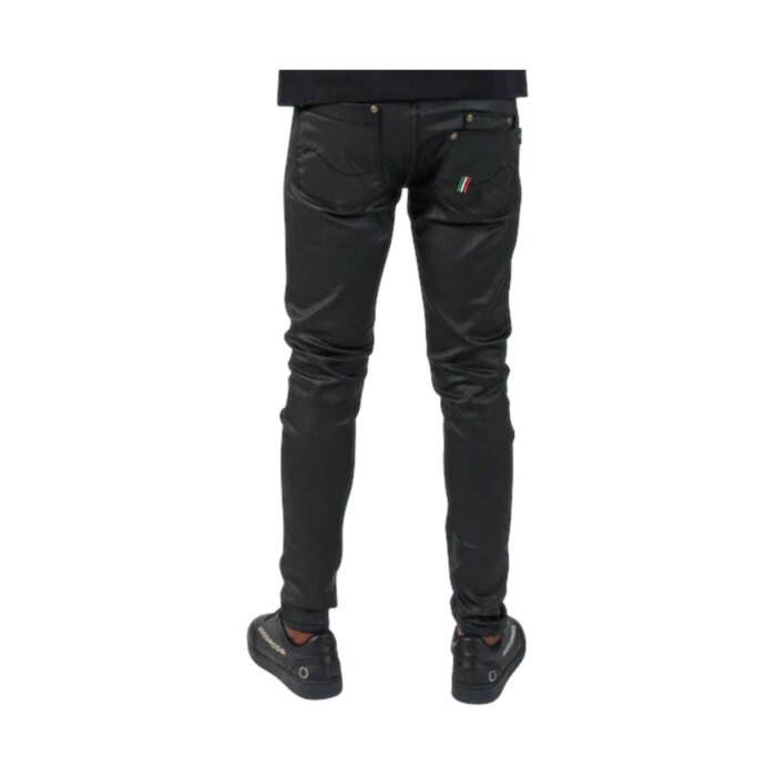 13 11 A | The Rossimoda Lorenzo Waxed Jeans Black is a premium blend of style and durability, featuring a sleek waxed finish that adds a subtle sheen while enhancing the deep black color, making it perfect for both casual and semi-formal occasions. Crafted from high-quality cotton with a touch of elastane, these slim-fit jeans provide exceptional comfort, flexibility, and breathability, ensuring a perfect fit that contours to your body while maintaining long-lasting shape retention. With practical five-pocket styling, a secure button-and-zip closure, and reinforced stitching for durability, these jeans offer both functionality and sophistication, making them a must-have staple for any modern wardrobe.