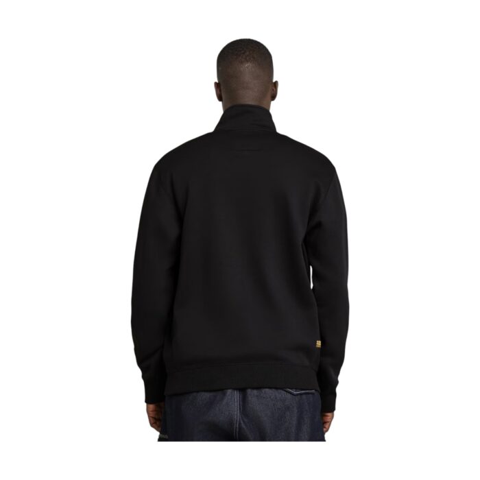 144 31 B | The G-Star RAW Premium Core Half Zip Sweater in Black blends modern design with practicality, featuring a sleek, minimalist aesthetic complemented by a functional half-zip collar that allows for adjustable ventilation and effortless layering. Crafted from a high-quality blend of organic cotton and recycled polyester, this sweater offers superior comfort, durability, and sustainability while ensuring a soft, breathable feel against the skin, making it an eco-conscious choice for everyday wear. Its ribbed cuffs and hem provide a structured fit, while the understated G-Star RAW logo adds a touch of refined branding, making it a versatile piece that seamlessly transitions between casual and polished looks.