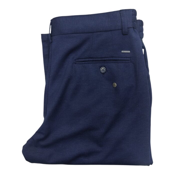 331 7 C | The Jonathan D Chino Regular Fit Navy is a sophisticated yet versatile wardrobe staple, crafted from high-quality cotton with a touch of elastane for durability, breathability, and all-day comfort, making it perfect for both casual and semi-formal occasions. Designed with a regular fit that provides ample room through the thighs and a tapered leg for a sleek silhouette, these chinos offer a refined look that pairs effortlessly with dress shirts, polos, or casual tees, adapting seamlessly to any style preference. With practical slanted front pockets, neatly stitched back pockets, and a rich navy hue that resists fading, this chino combines functionality with timeless elegance, ensuring you always step out in style.